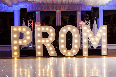 PROM light up letters set up in pavilion room for a prom